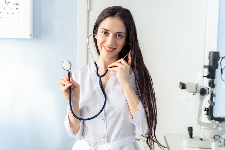 Confident female doctor holding a stethoscope while smiling in a clinic setting