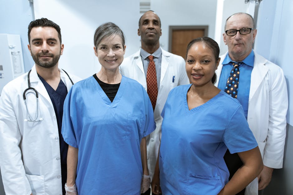 Group of diverse healthcare professionals posing confidently indoors